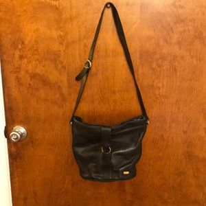 Liz Claiborne’s black leather purse